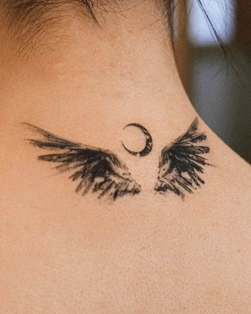Crescent Moon Neck Wings Tattoo