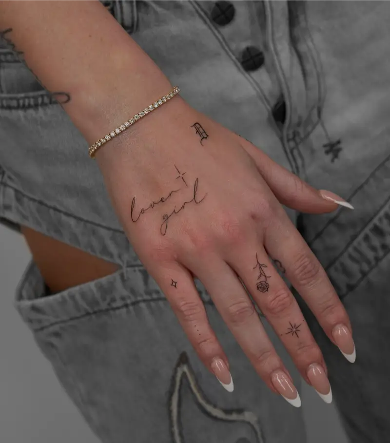 Delicate Lettering Patchwork Hand Tattoo