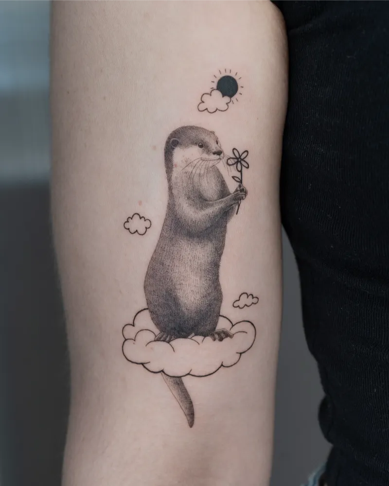 Dreamy & Playful Cloud Otter Tattoo