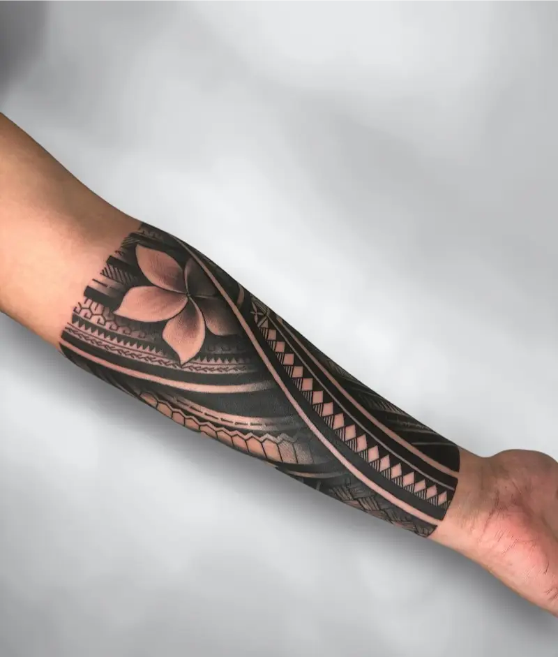 Elegant Polynesian Plumeria Forearm Tattoo