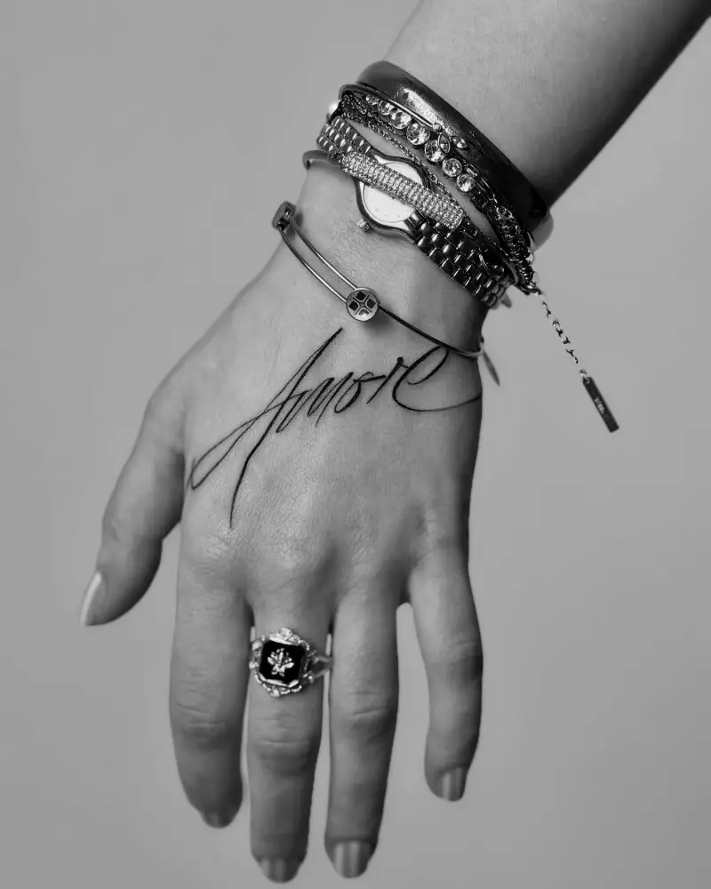 Elegant Script Amore Hand Tattoo