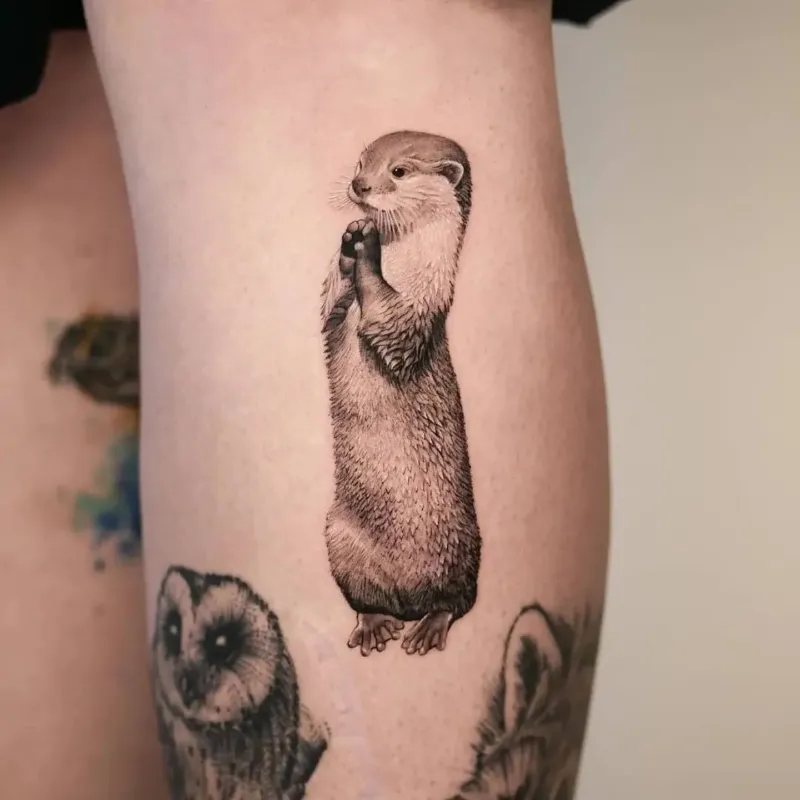 Fine Line Standing Otter Tattoo