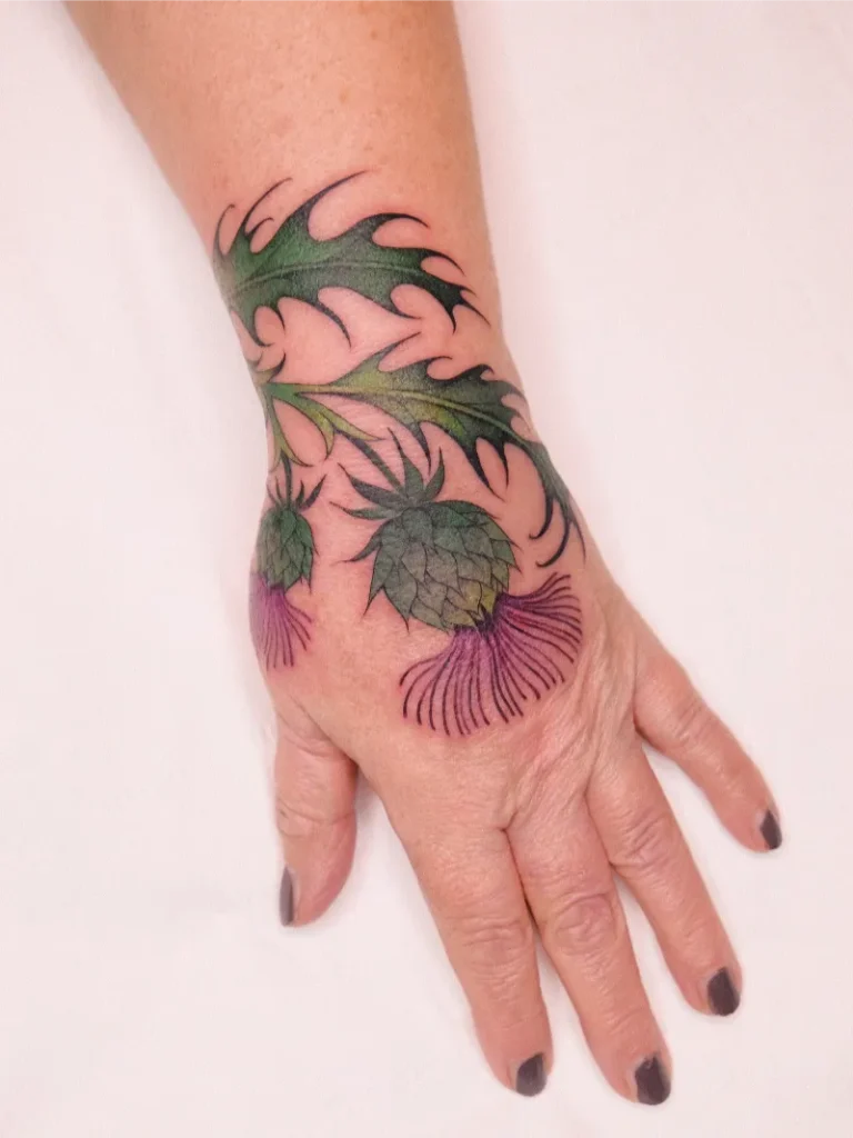 Flowing Botanical Thistle Hand Tattoo