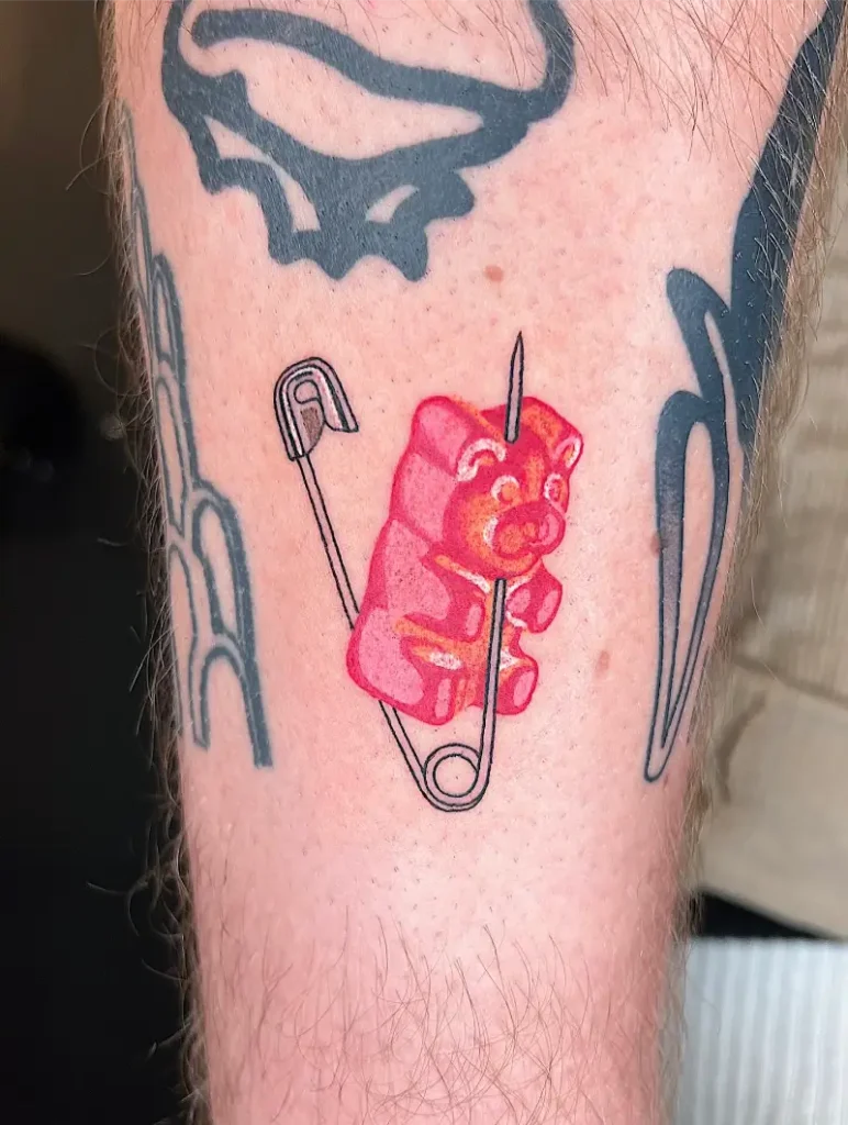 Illustrative Safety Pin Gummy Bear Tattoo