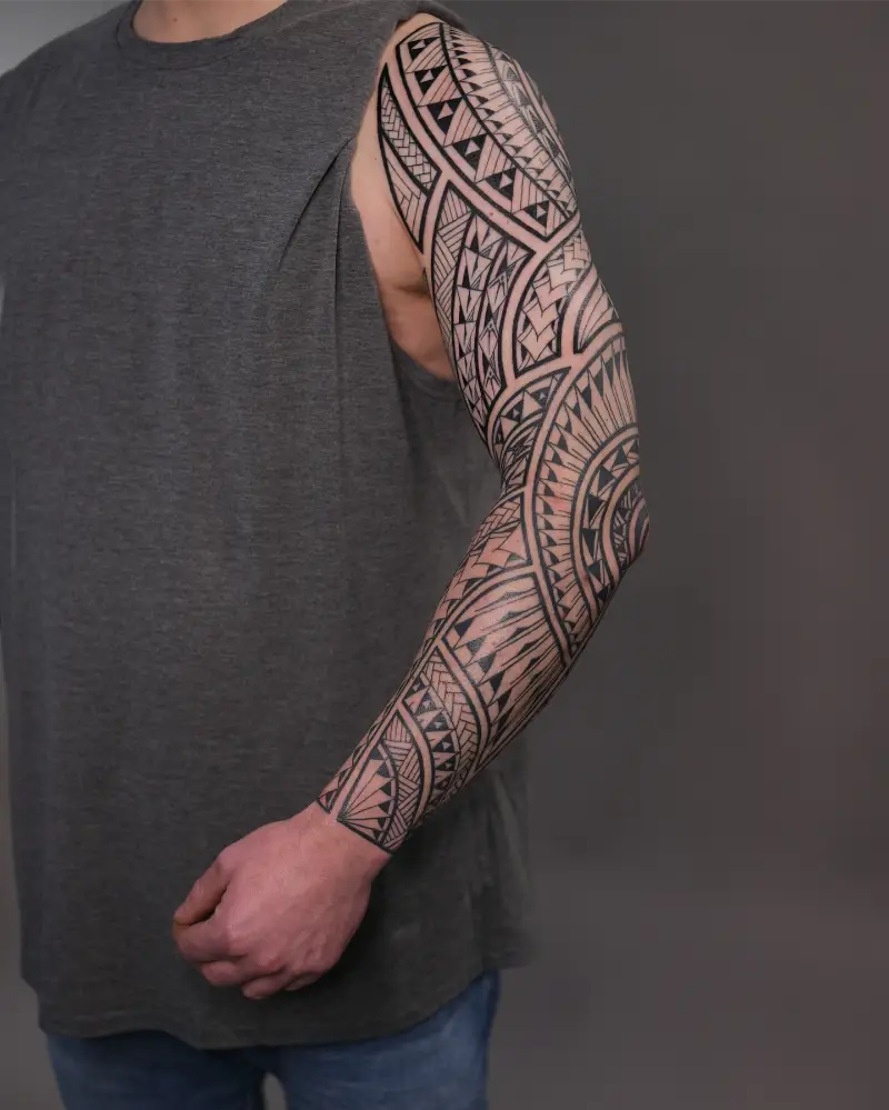 Intricate Polynesian Full Sleeve Tattoo
