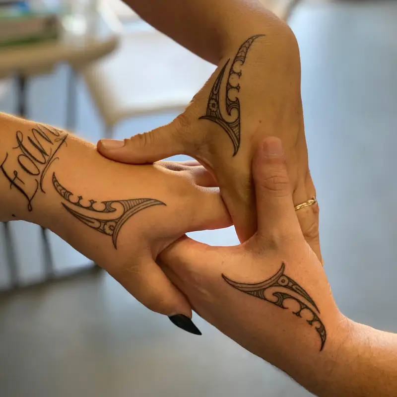 Matching Ta Moko Hand Tattoos
