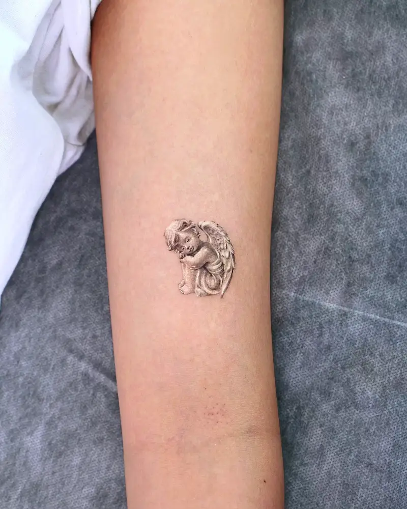 Micro Realism Cherub Statue Tattoo