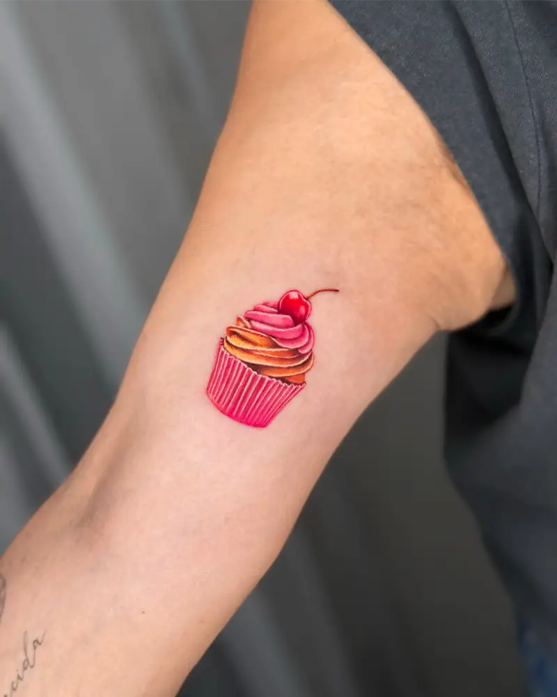 Micro Realistic Cherry Cupcake Tattoo