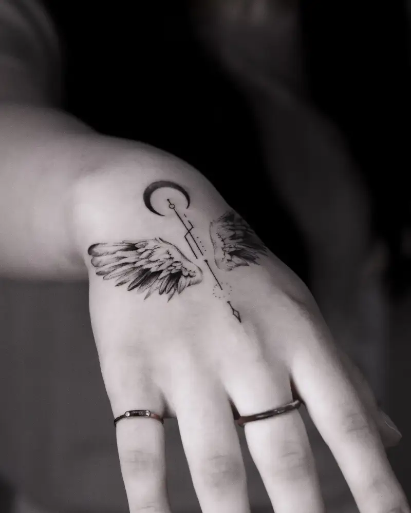Minimal Celestial Wing Hand Tattoo