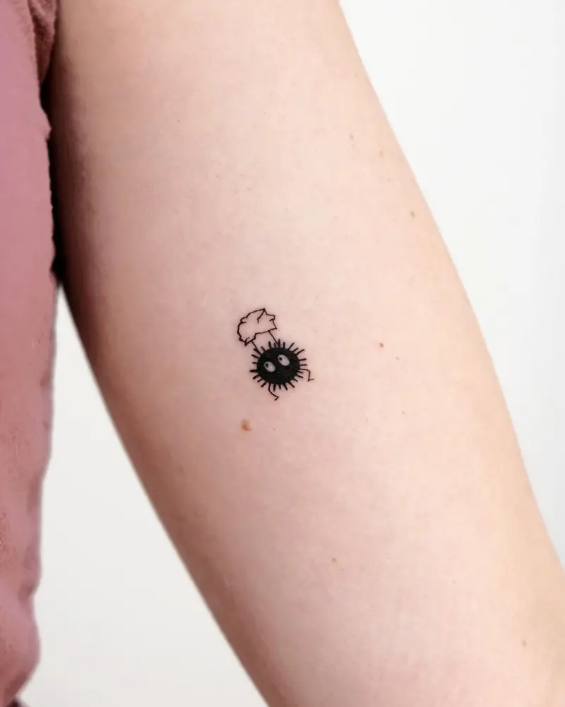 Minimalist Soot Sprite Leaf Hat Tattoo