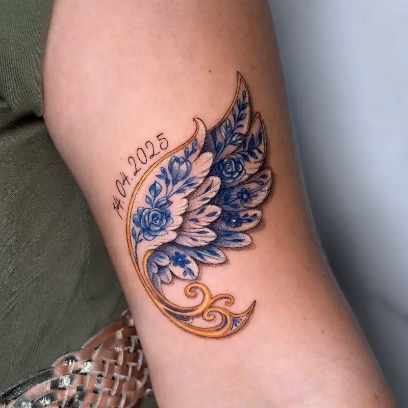 Ornamental Blue Floral Wing Tattoo