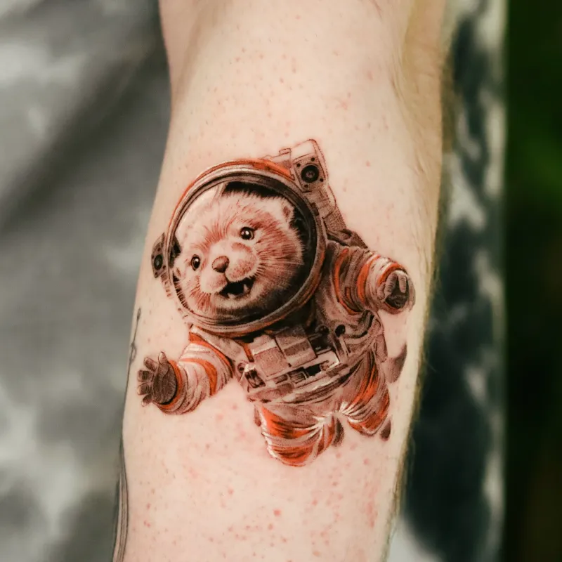Playful Astronaut Otter Tattoo