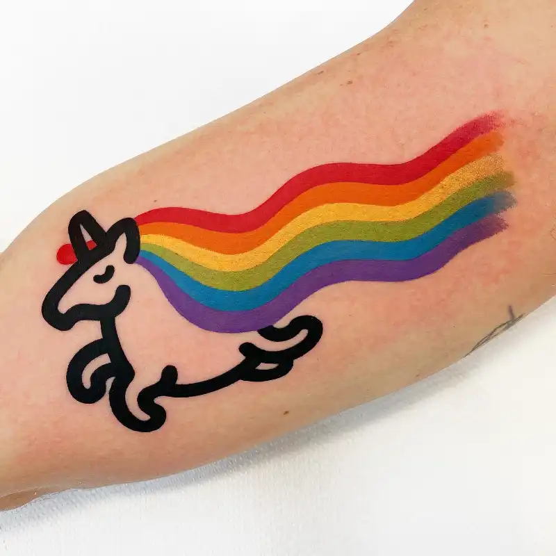 Playful Rainbow Unicorn Tattoo