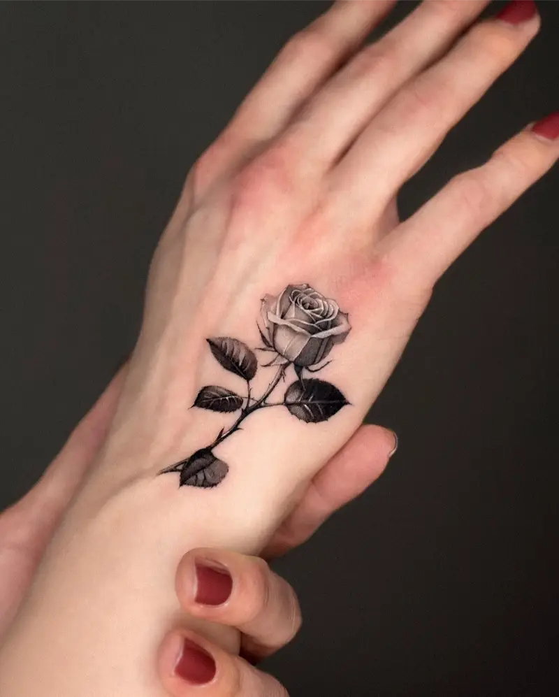 Realistic Black and Grey Rose Hand Tattoo