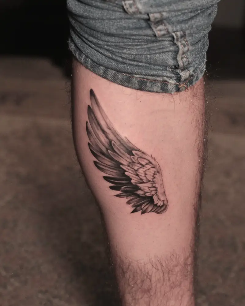 Realistic Black and Grey Single Wing Tattoo