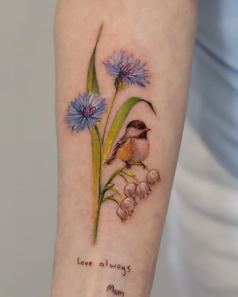 Realistic Cornflower and Songbird Memorial Tattoo