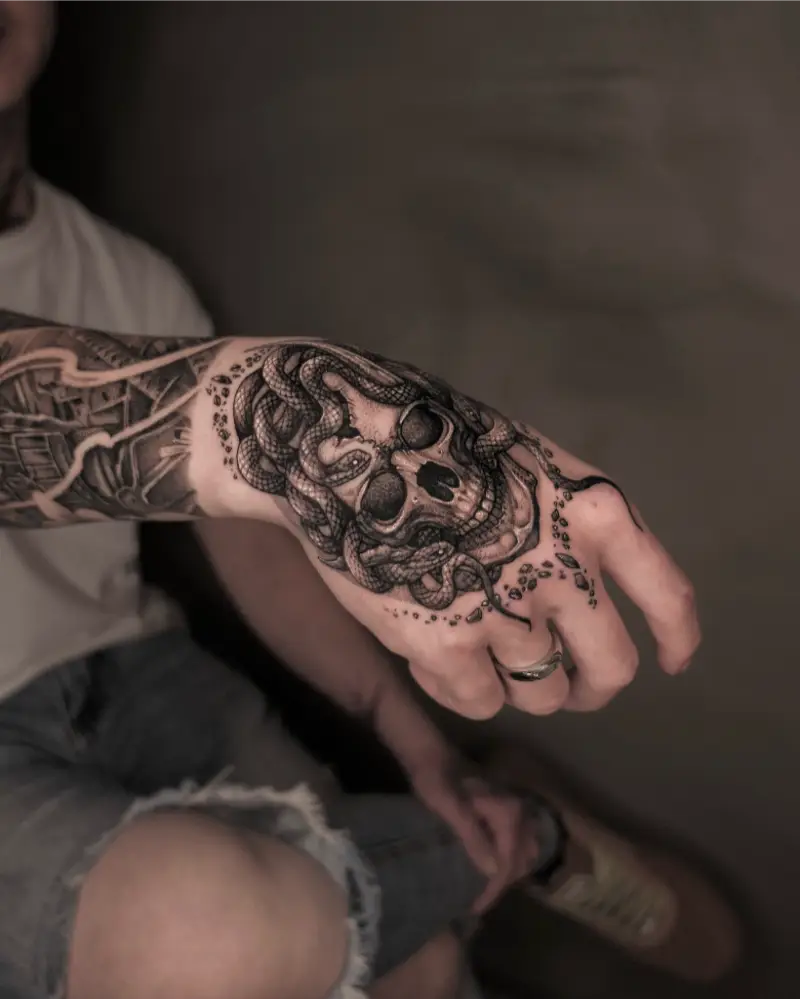 Realistic Medusa Skull Hand Tattoo