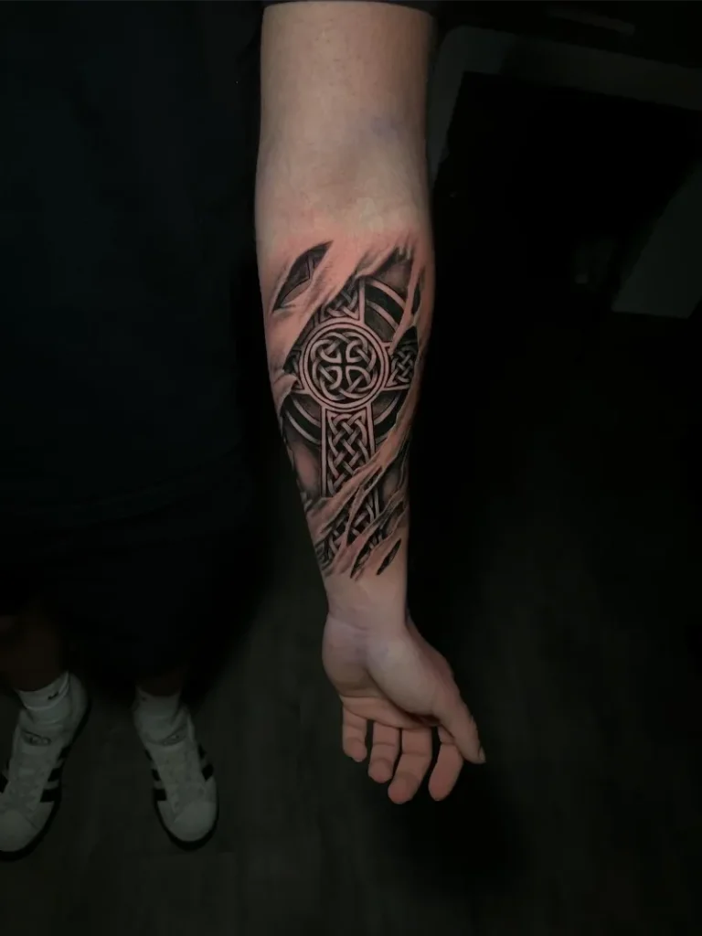 Ripped Skin Celtic Cross Tattoo