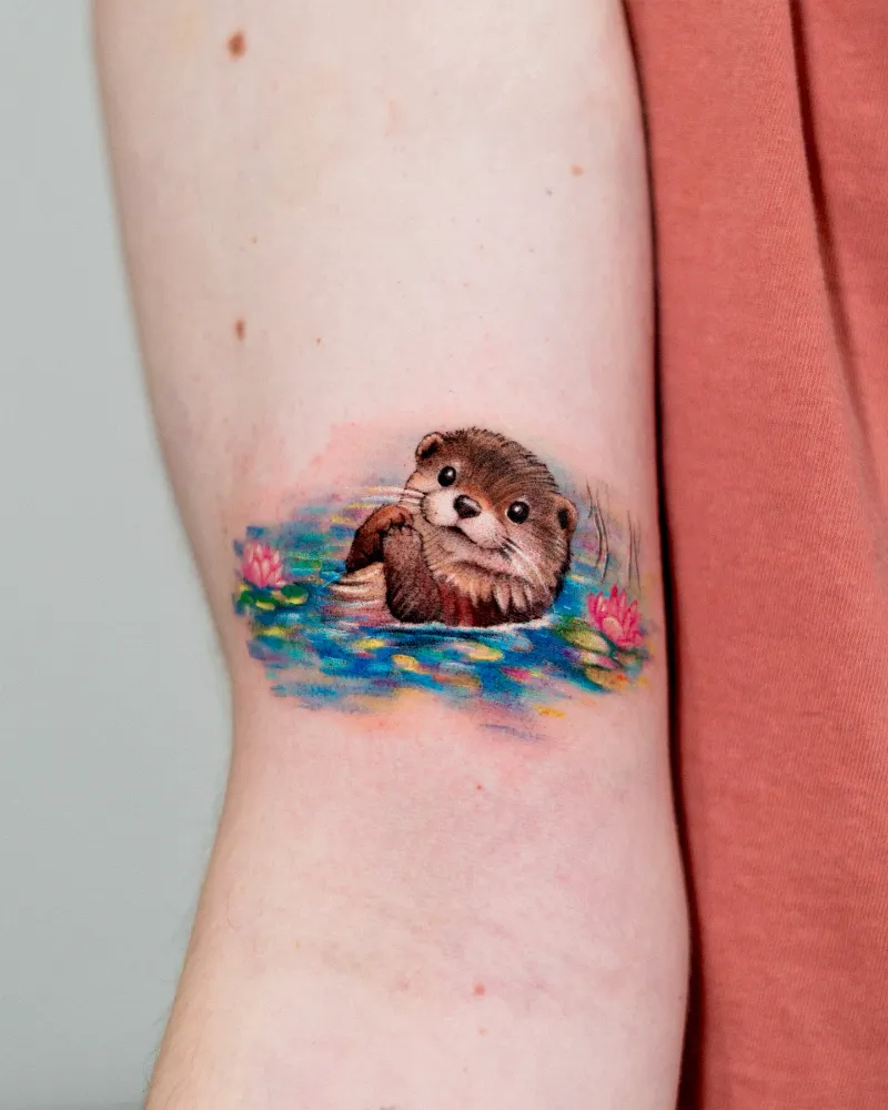Smiling Watercolor Otter Tattoo