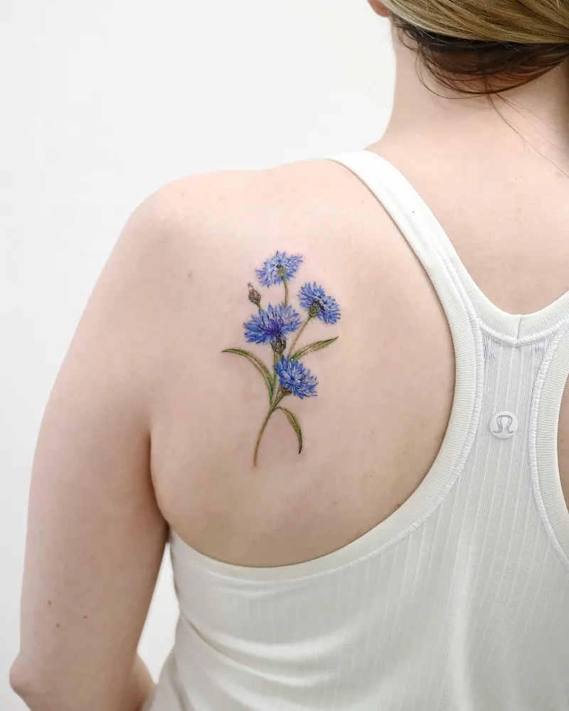 Soft Botanical Cornflower Shoulder Tattoo