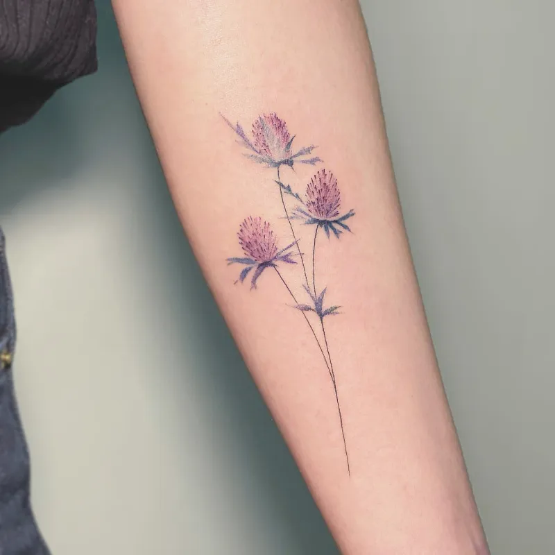 Soft Watercolor Thistle Bouquet Tattoo