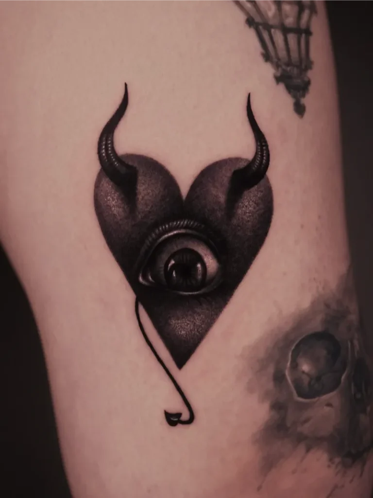 Surreal Devil Heart Eye Tattoo