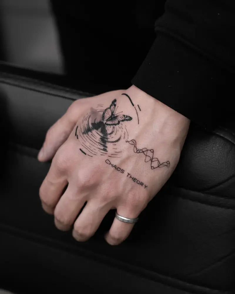 Surreal Fine Line Butterfly Chaos Theory Hand Tattoo