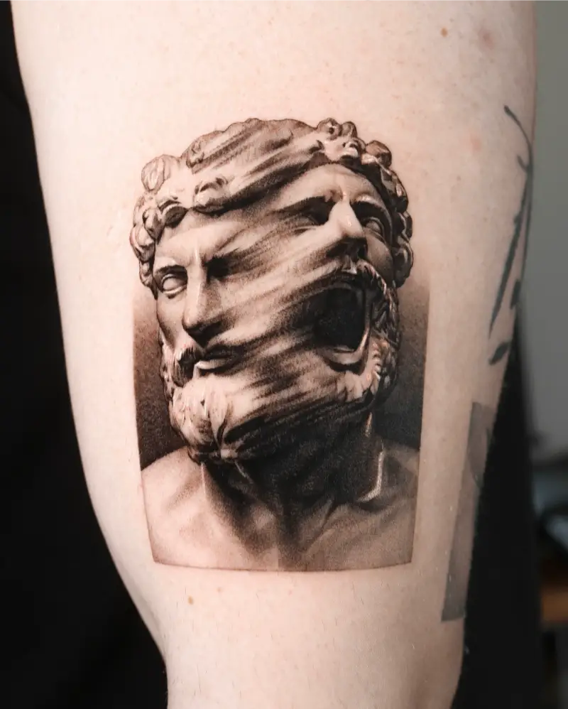 Surreal Split-Face Greek God Tattoo