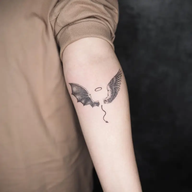 Symbolic Angel and Devil Wings Tattoo