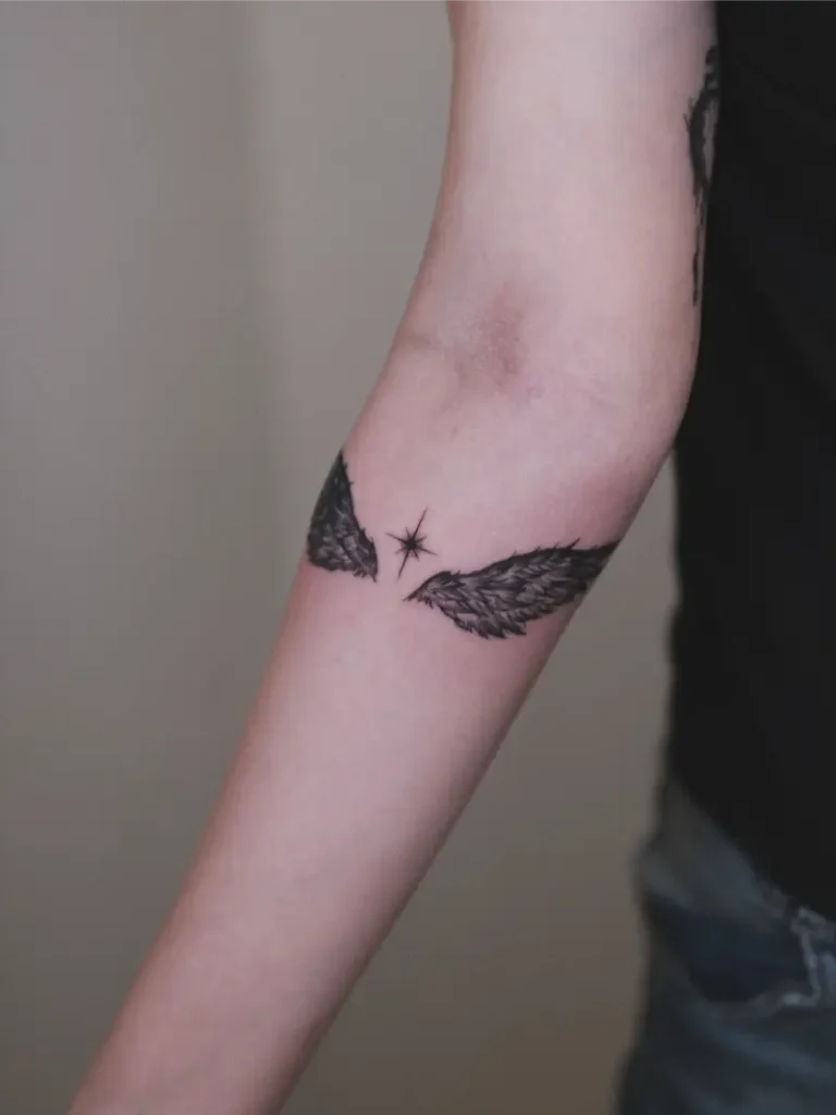 Tiny Minimal Angel Wings Tattoo