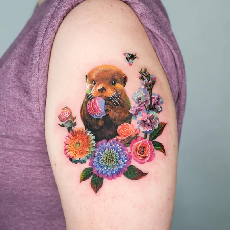 Vibrant Floral Otter Tattoo
