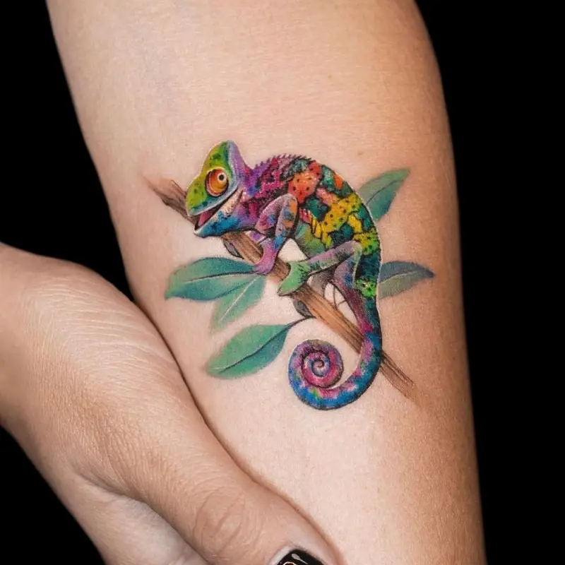 Vibrant Playful Chameleon Branch Tattoo