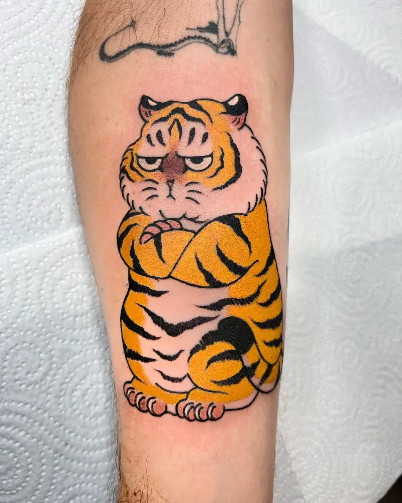 Whimsical Cartoon Tiger Tattoo