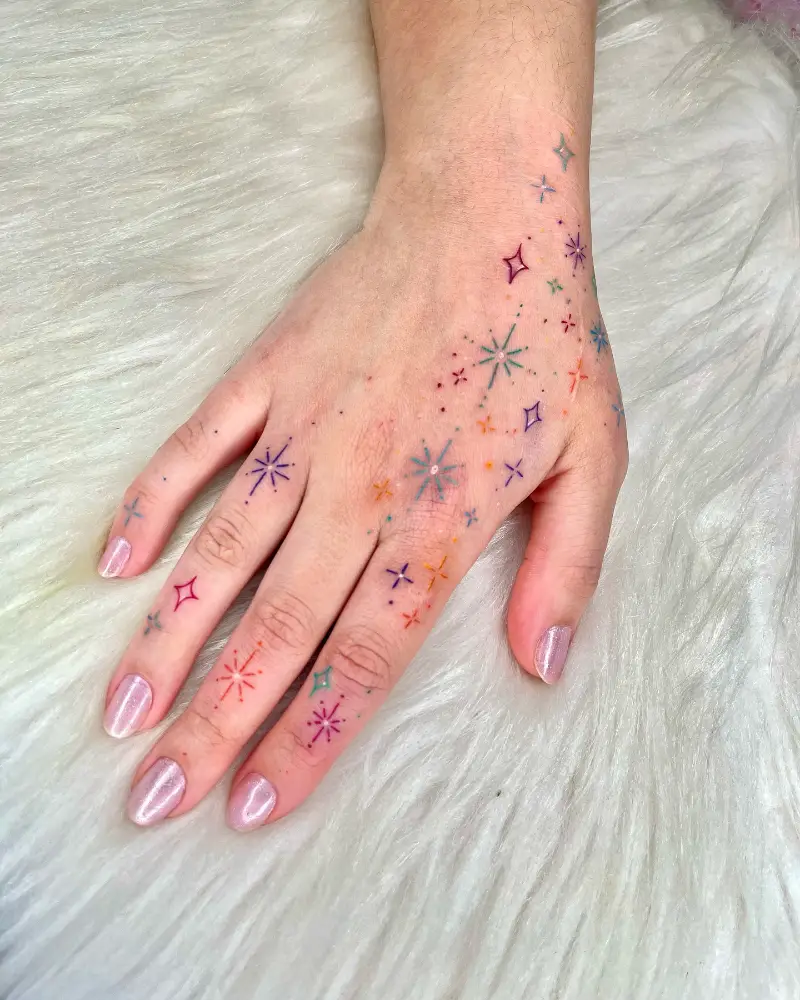 Whimsical Colorful Sparkle Hand Tattoo
