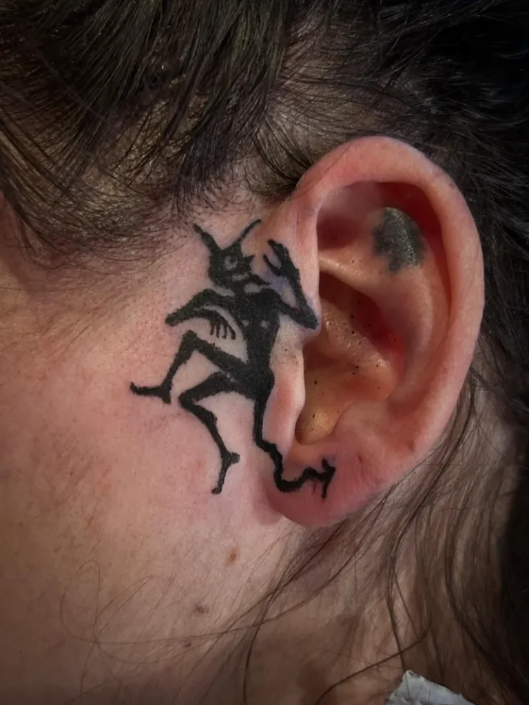 Whispering Devil Ear Tattoo