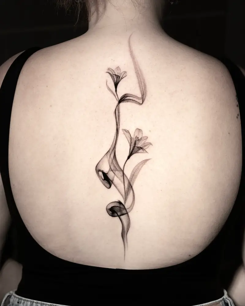 Abstract Fine Line Lily Spine Tattoo