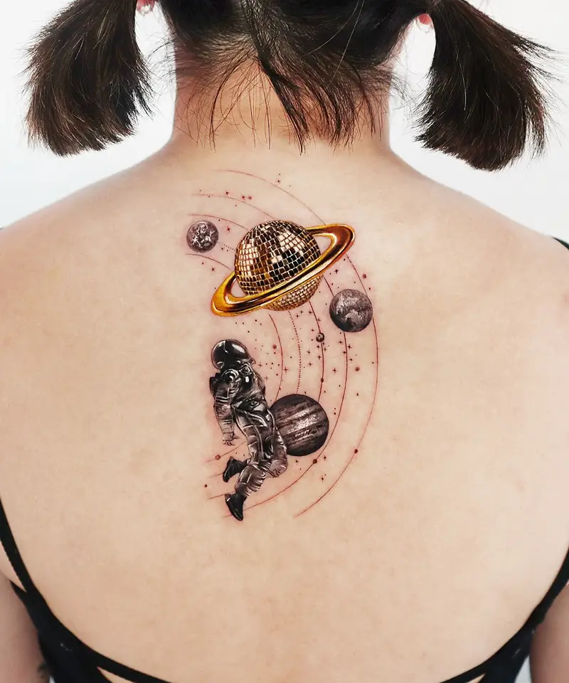 Astronaut and Disco Ball Saturn Tattoo