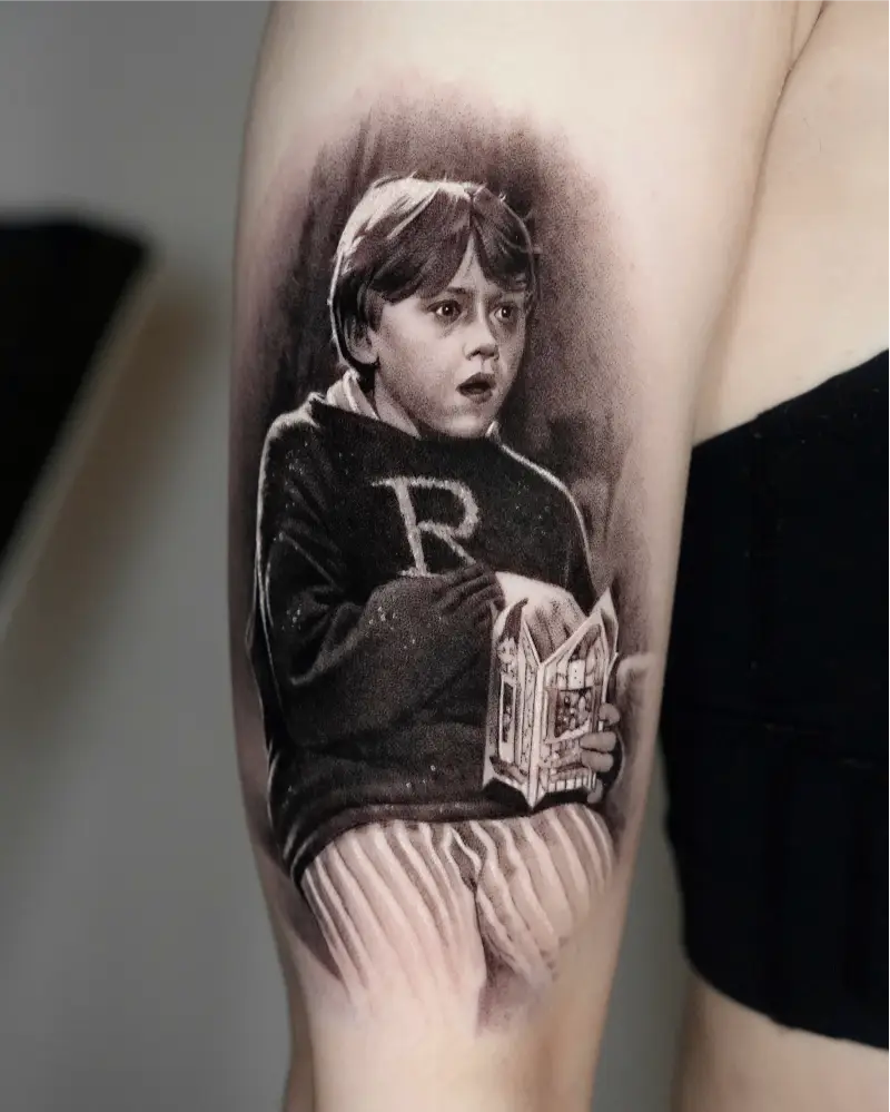 Black and Grey Young Ron Weasley Portrait Tattoo