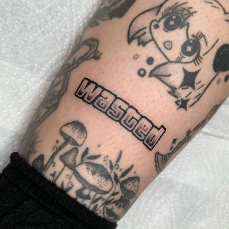 Bold GTA Wasted Lettering Tattoo