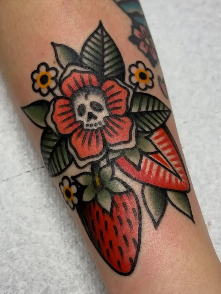 Bold Traditional Skull Flower Strawberry Tattoo