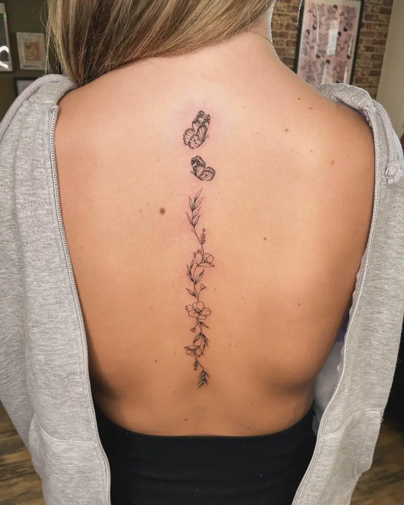 Butterfly and Wildflower Spine Tattoo