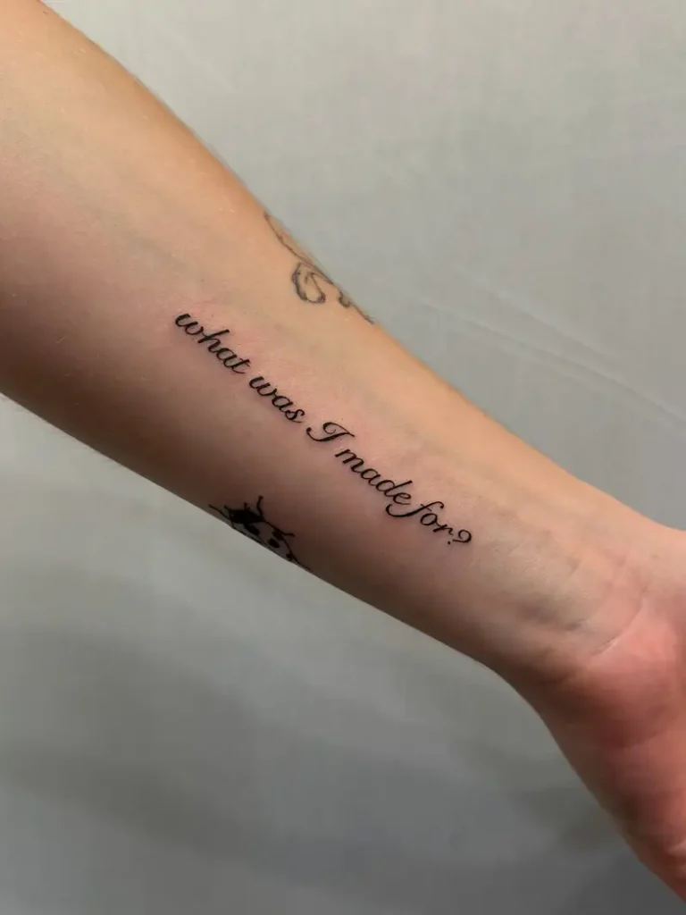 Delicate Script What Was I Made For? Quote Tattoo