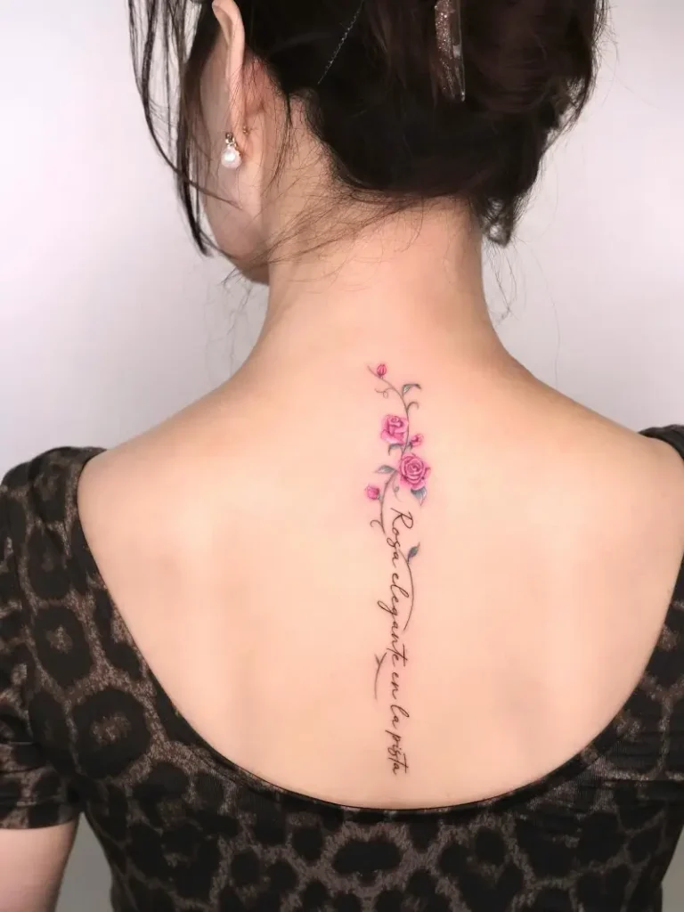 Delicate Script and Rose Spine Tattoo