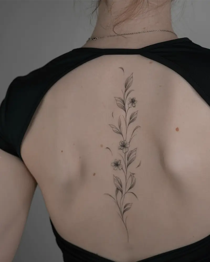 Delicate Wildflower Spine Tattoo