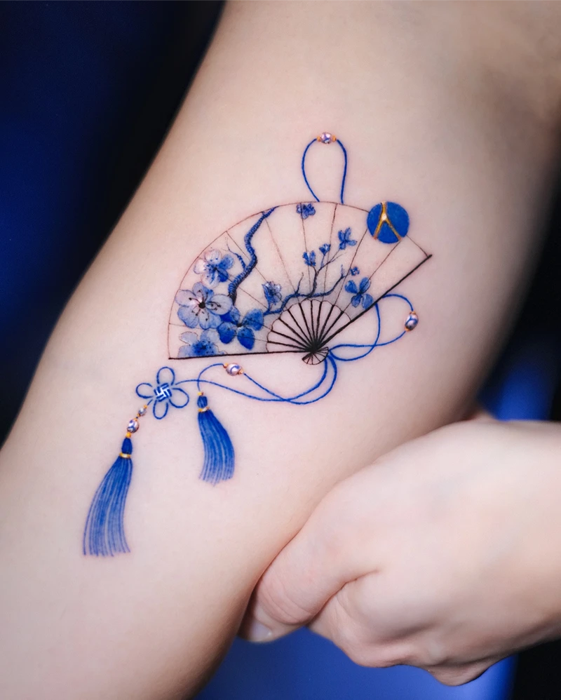 Elegant Blue Blossom Fan Tattoo