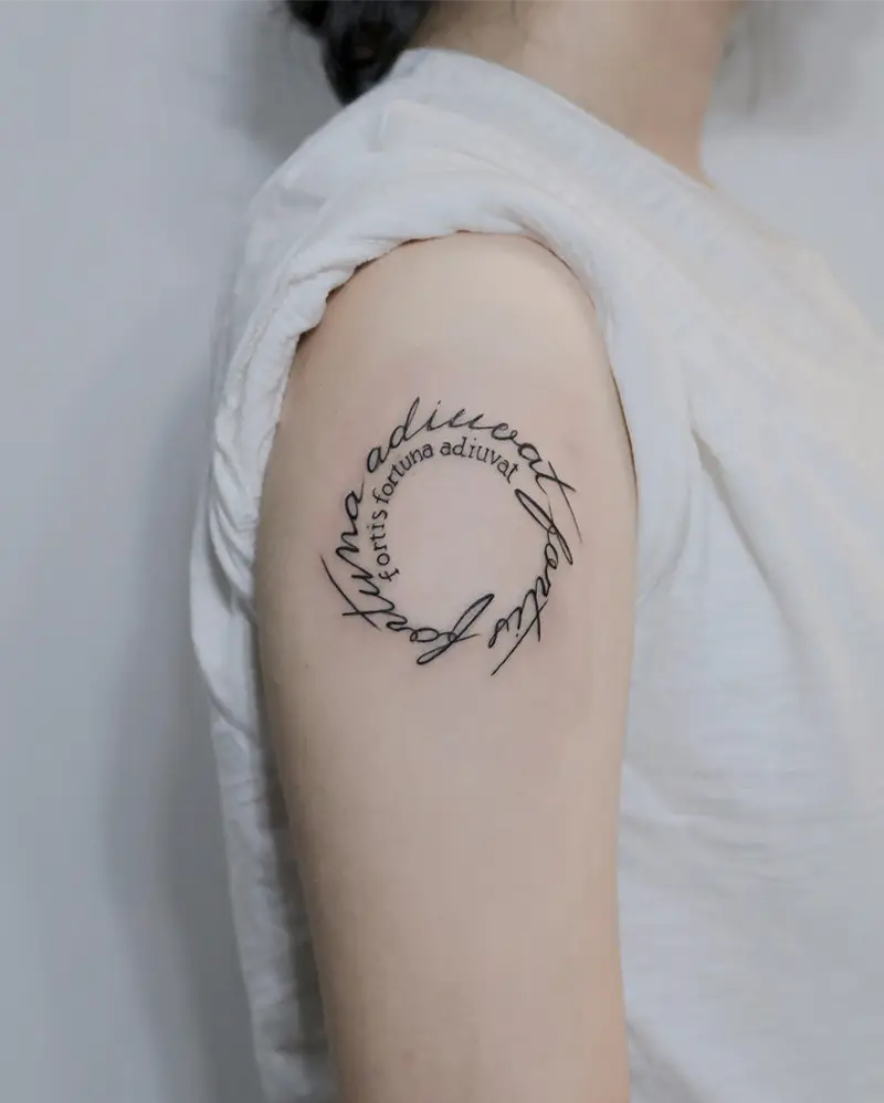 Elegant Circular Script Quote Tattoo