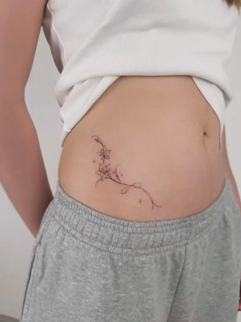Elegant Floral Vine Side Belly Tattoo