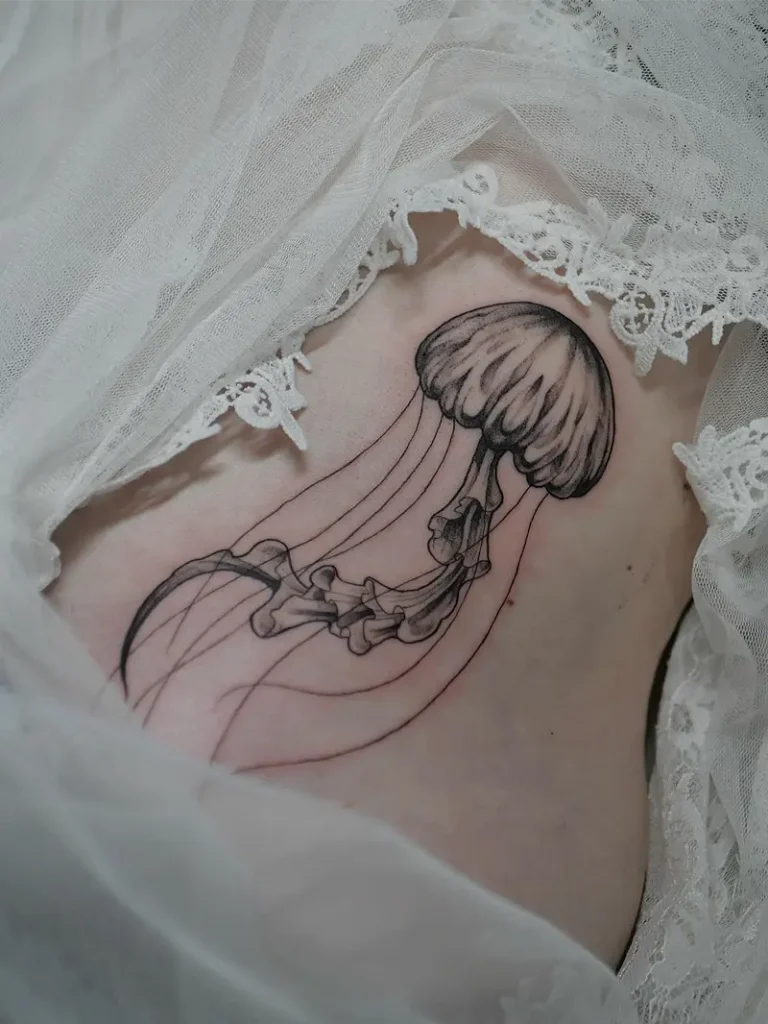 Elegant Jellyfish Belly Tattoo