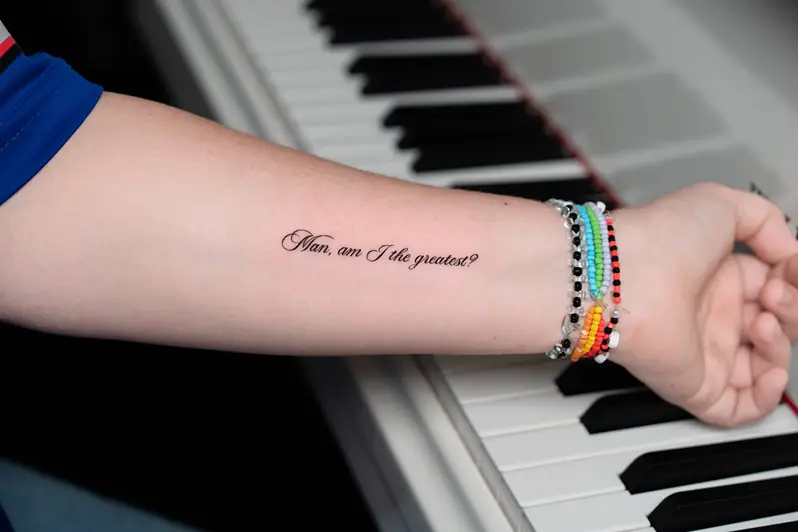 Elegant Script The Greatest Lyric Tattoo