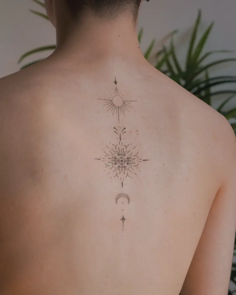 Fine Line Celestial Mandala Spine Tattoo